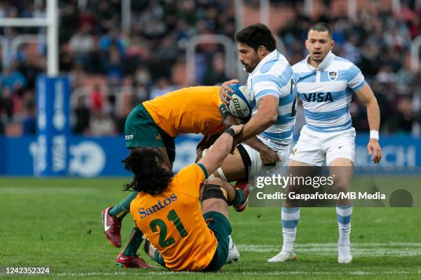 Rodrigo Bruni of Argentina is tackled by Len Ikitau of Australia and Pete Samu of Australia during the Rugby Championship match between Argentina...