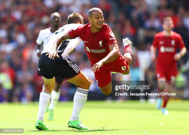 Joao Palhinha of Fulham tackles Thiago Alcantara of Liverpool during the Premier League match between Fulham FC and Liverpool FC at Craven Cottage on...