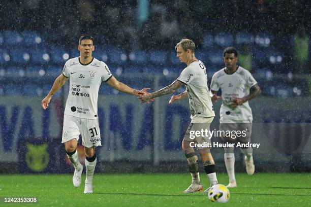 Fabián Balbuena of Corinthians celebrates with Róger Guedes after scoring the first goal of his team during a match between Avai and Corinthians as...