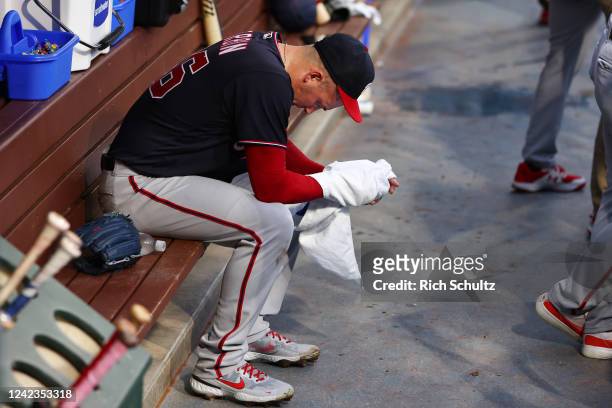 Starting pitcher Patrick Corbin of the Washington Nationals sits by himself in the dugout after being relieved in the first inning of a game against...