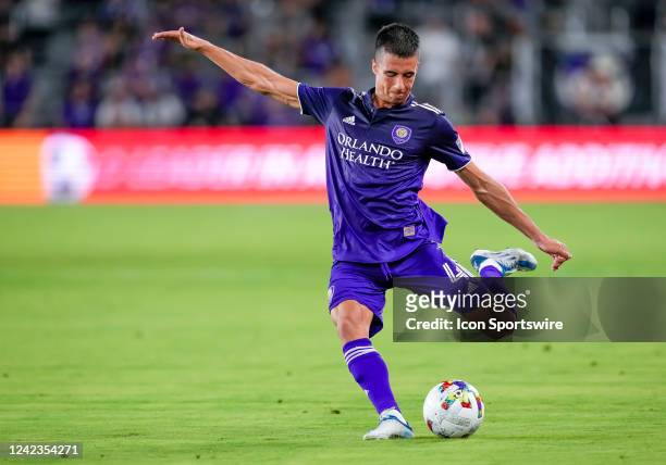 Orlando City defender João Moutinho shoots the ball during the MLS soccer match between the Orlando City SC and New England Revolution on August 6th,...