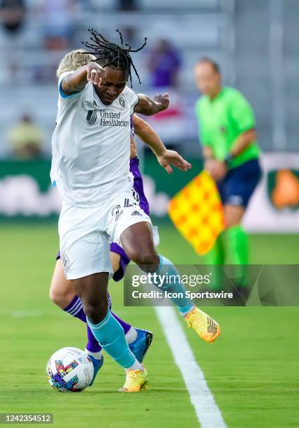 New England Revolution forward DeJuan Jones steals the ball from Orlando City midfielder Mauricio Pereyra during the MLS soccer match between the...