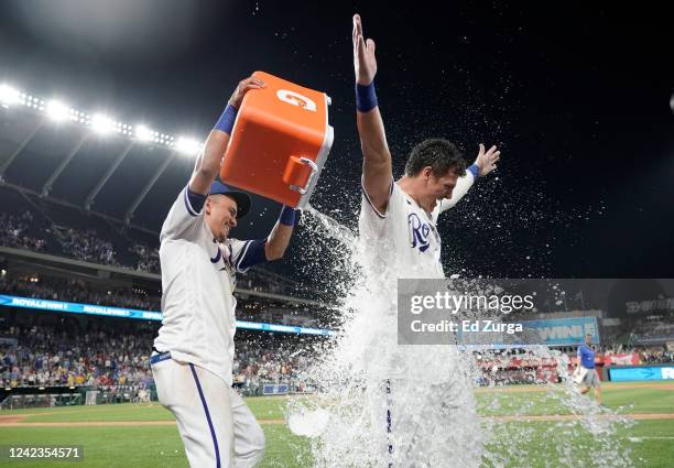 Nick Pratto of the Kansas City Royals is doused with water by Nicky Lopez after his walk-off home run in ninth inning against the Boston Red Sox at...