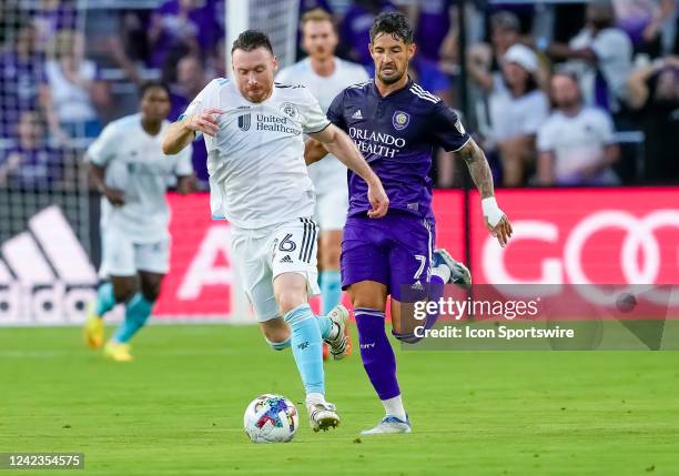 New England Revolution midfielder Thomas McNamara runs with the ball during the MLS soccer match between the Orlando City SC and New England...