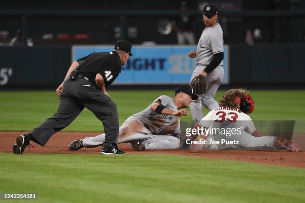 Brendan Donovan of the St. Louis Cardinals is tagged out by Isiah Kiner-Falefa of the New York Yankees stealing second base in the eighth inning at...