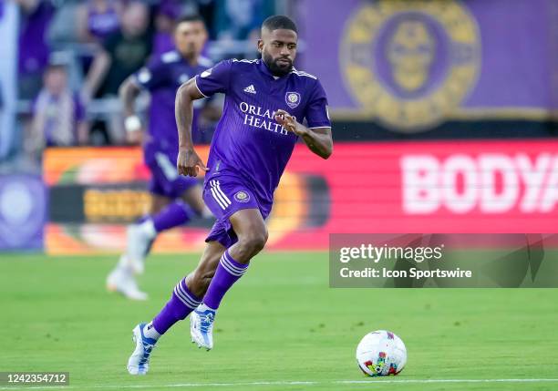 Orlando City defender Ruan runs with the ball during the MLS soccer match between the Orlando City SC and New England Revolution on August 6th, 2022...