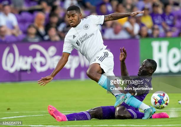 Orlando City forward Benji Michel makes a slide tackle for a save during the MLS soccer match between the Orlando City SC and New England Revolution...