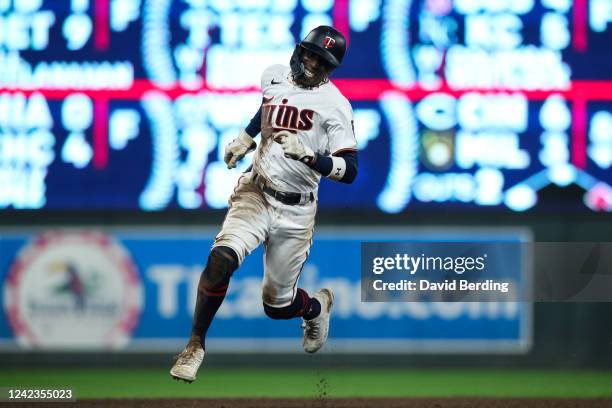 Nick Gordon of the Minnesota Twins advances to home plate to score on an RBI triple by Jake Cave against the Toronto Blue Jays in the eighth inning...