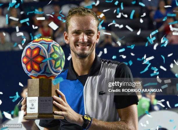 Russia's Daniil Medvedev holds the winning trophy after defeating Britain's Cameron Norrie during their Mexico ATP Open 250 men's singles final...