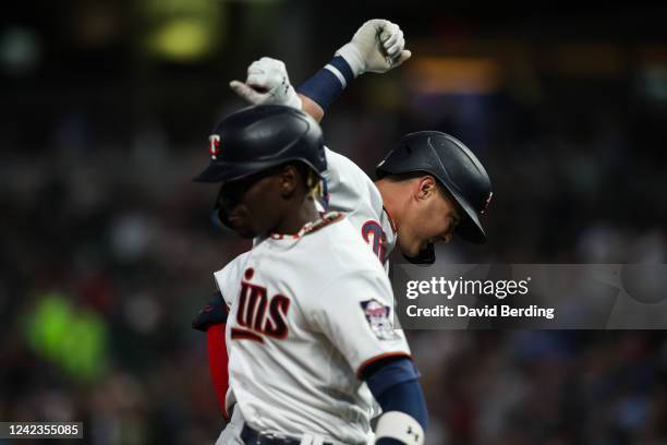 Jose Miranda of the Minnesota Twins celebrates his solo home run with Nick Gordon against the Toronto Blue Jays in the sixth inning of the game at...