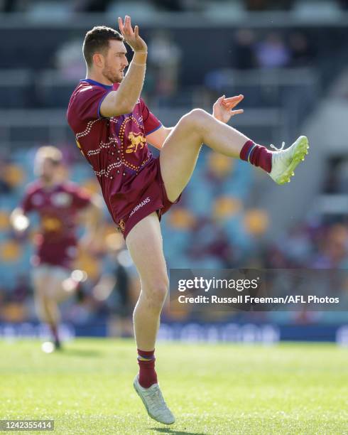 Daniel McStay of the Lions warms up before the 2022 AFL Round 21 match between the Brisbane Lions and the Carlton Blues at The Gabba on August 7,...