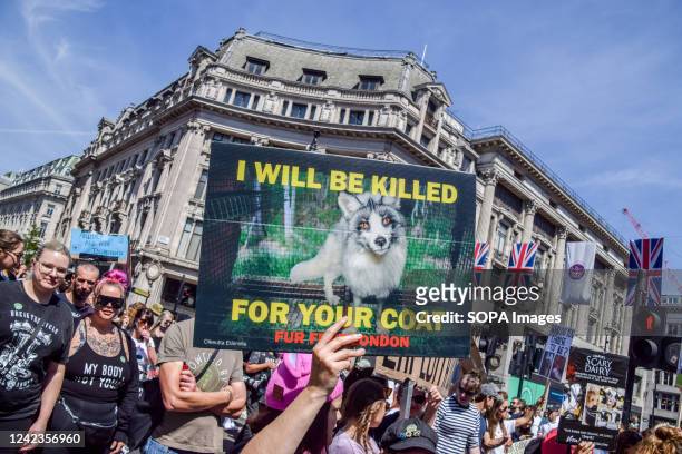 Protester holds an anti-fur placard during the demonstration in Oxford Circus. Thousands of people marched through central London in support of...