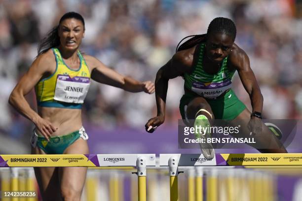 Nigeria's Tobi Amusan competes for first place alongside Australia's Michelle Jenneke during the women's 100m hurdles final athletics event at the...