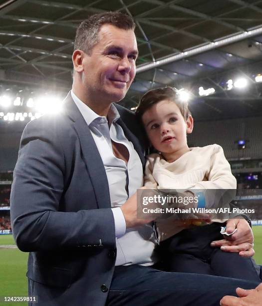 Wayne Carey is seen with son Carter during the 2022 AFL Round 21 match between the North Melbourne Kangaroos and the Sydney Swans at Marvel Stadium...