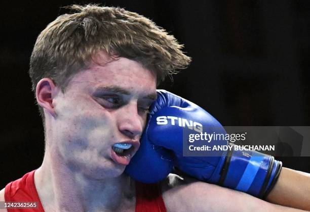 Scotland's Sam Hickey takes a punch from Australia's Callum Peters during their Men's Middle weight boxing final on day ten of the Commonwealth Games...