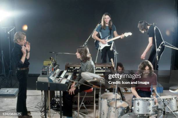 Film director Adrian Maben, keyboardist Richard Wright , guitarist, songwriter and lead singer David Gilmour, drummer Nick Mason and bassist, singer...