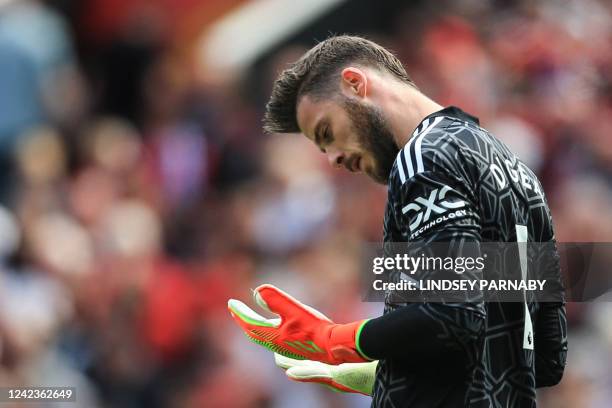 Manchester United's Spanish goalkeeper David de Gea reacts during the English Premier League football match between Manchester United and Brighton...