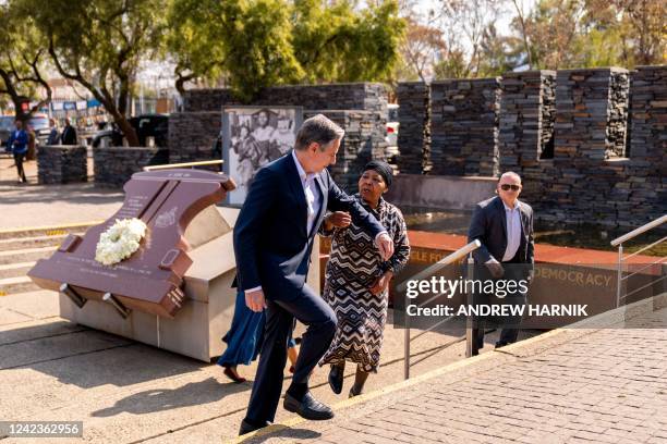 Secretary of State Antony Blinken and Antoinette Sithole , the sister of the late Hector Pieterson, speak together after laying a wreath at the...