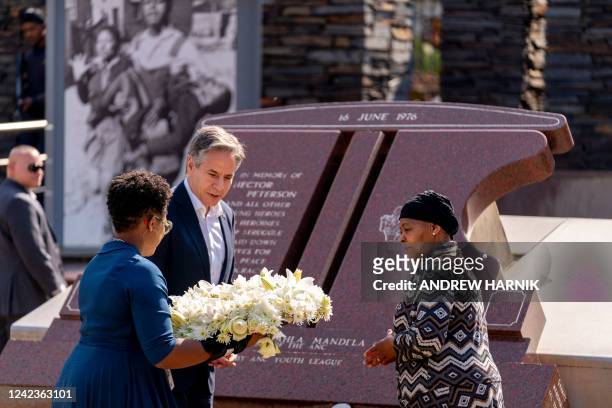 Secretary of State Antony Blinken and Antoinette Sithole , the sister of the late Hector Pieterson, lay a wreath at the Hector Pieterson Memorial in...
