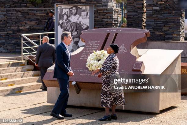 Secretary of State Antony Blinken greets Antoinette Sithole , the sister of the late Hector Pieterson, as he visits the Hector Pieterson Memorial in...