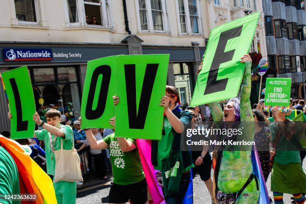 Supporters of the Green Party take part in the 30th anniversary Brighton & Hove Pride LGBTQ+ Community Parade on 6th August 2022 in Brighton, United...