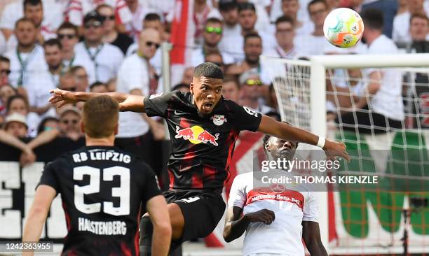 Leipzig's German defender Benjamin Henrichs and Stuttgart's French midfielder Naouirou Ahamada vie for the ball during the German first division...