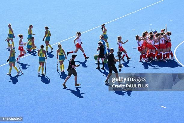 England's players celebrate their win at the end of the women's gold medal hockey match between England and Australia on day ten of the Commonwealth...