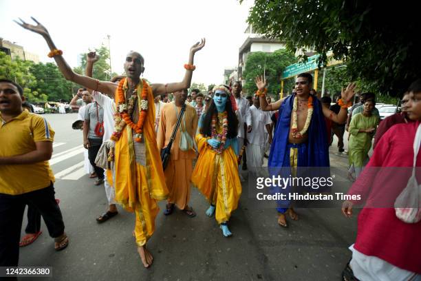 Devotees during a grand Shobha Yatra ahead of Janmashtami, organized by ISKCON, on August 7, 2022 in Noida, India.