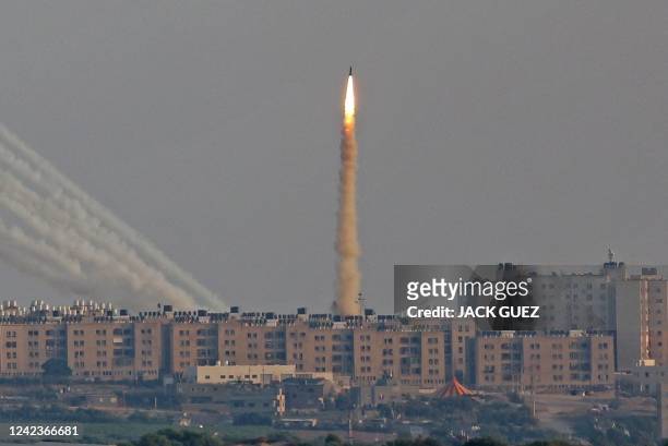 This picture taken from the southern Israeli city of Ashkelon shows Palestinian rockets fired from the Gaza Strip on August 7, 2022. Israel agreed to...