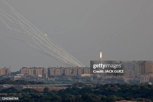 This picture taken from the southern Israeli city of Ashkelon shows Palestinian rockets fired from the Gaza Strip on August 7, 2022. Israel agreed to...