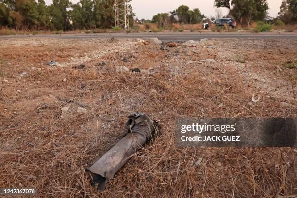 This picture shows the remains of a rocket launched from the Gaza Strip in the southern Israeli city of Ashkelon on August 7, 2022. - Israel agreed...