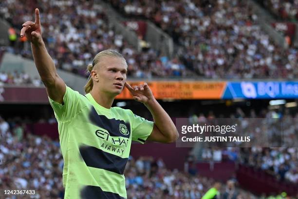 Manchester City's Norwegian striker Erling Haaland celebrates after scoring their second goal during the English Premier League football match...