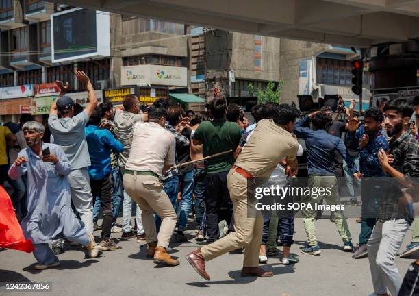 Indian policemen charge batons on Shia Muslim mourners during a religious procession on the 8th day of Muharram. Authorities imposed strict...