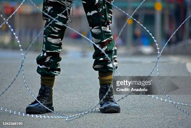 An Indian paramilitary soldier stands alert during restrictions imposed by authorities to prevent Muharram processions on 8th of Muharram, the first...