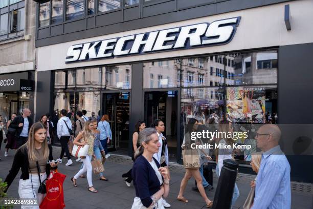 Shoppers and visitors pass the Skechers shop on Oxford Street on 22nd July 2022 in London, United Kingdom. Oxford Street is a major retail centre in...