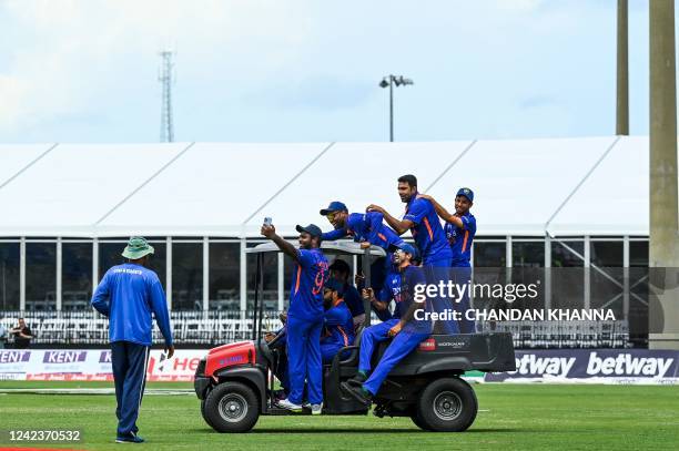 Team India ride on a quad-motor around the field as they celebrate after winning the fifth and final T20I match between West Indies and India at the...