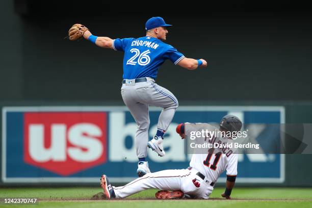 Jorge Polanco of the Minnesota Twins is out at second base as Matt Chapman of the Toronto Blue Jays watches his throw to first base on a fielder's...