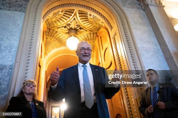 Senate Majority Leader Chuck Schumer gives the thumbs up as he leaves the Senate Chamber after passage of the Inflation Reduction Act at the U.S....