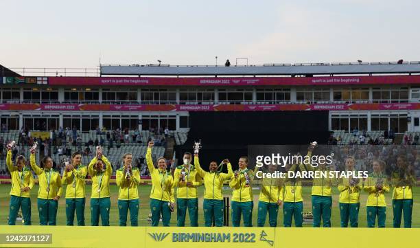 Gold medalists Australia stand on the podium during the medal ceremony for the women's Twenty20 Cricket on day ten of the Commonwealth Games at...