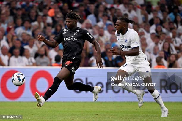 Reims' Malian forward El Bilal Toure fights for the ball with Marseille's Portuguese defender Nuno Tavares during the French L1 football match...