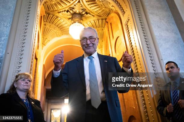 Senate Majority Leader Chuck Schumer gives the thumbs up as he leaves the Senate Chamber after passage of the Inflation Reduction Act at the U.S....