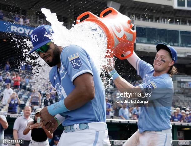 Melendez of the Kansas City Royals is doused with water by Bobby Witt Jr. #7 as they celebrate a 13-5 win over the Boston Red Sox at Kauffman Stadium...