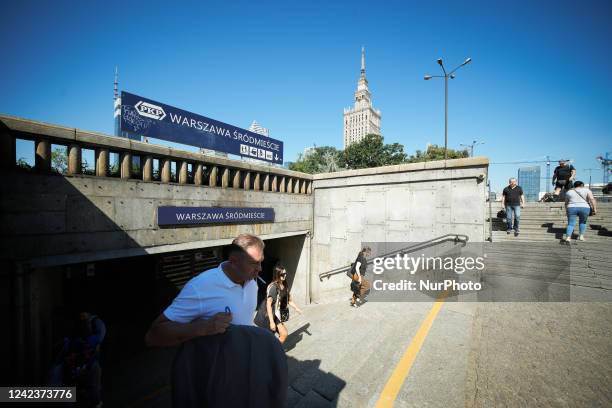 People are seen exiting the Srodmiescie or downtown train station in Warsaw, Poland on 7 August, 2022.