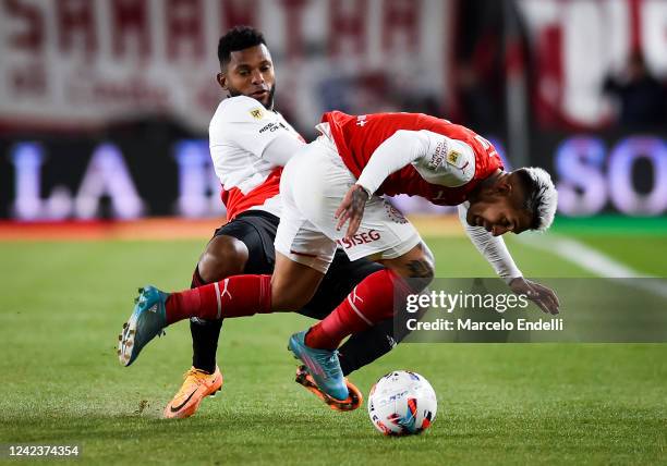 Damian Batallini of Independiente fights for the ball with Miguel Borja of River Plate during a match between Independiente and River Plate as part...
