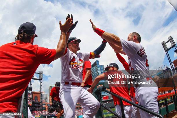 Nolan Arenado of the St. Louis Cardinals is congratulated by teammates after hitting a three-run home run against the New York Yankees in the second...