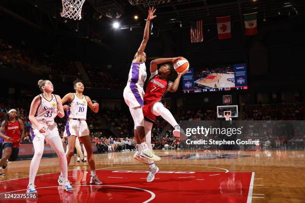 Ariel Atkins of the Washington Mystics drives to the basket during the game against the Los Angeles Sparks on August 7, 2022 at Entertainment &...