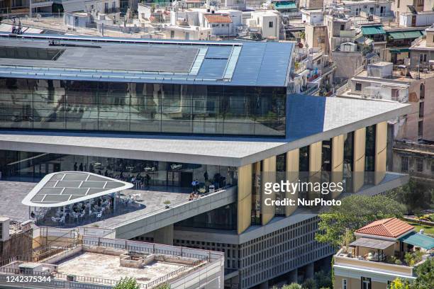 The Acropolis Museum in Athens as seen from the hill of Acropolis and the Parthenon. The exterior panoramic view of the archaeological museum, that...