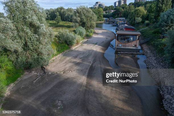 The river Waal and from the German side the Rhine is seen on 8 July 2022 with a very low water level, cargo ships find it difficult to navigate the...