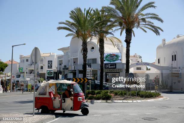 Tuk-tuk driver waits for clients in Albufeira, Algarve region, Portugal on August 6, 2022. Tourism is rebounding more quickly in Portugal than in...