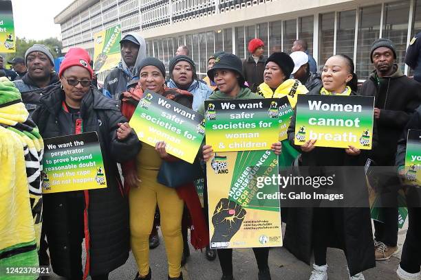 African National Congress members protest outside Krugersdorp Magistrate's Court on August 03, 2022 in Krugersdorp, South Africa. This comes after...